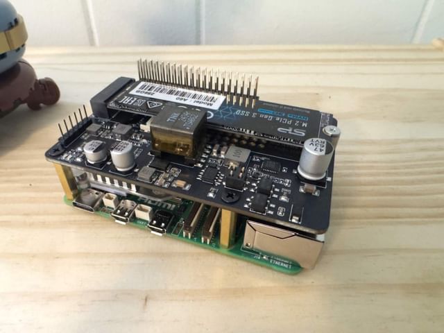 Raspberry Pi 5 on desk with case and heatsink